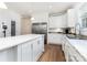 Bright kitchen featuring stainless steel refrigerator, a center island, and light colored counters at 1593 Bloomfield Rd, Rock Hill, SC 29732