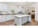 Bright kitchen featuring a center island, modern appliances, and hardwood flooring at 1593 Bloomfield Rd, Rock Hill, SC 29732