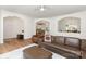 Inviting living room with archways, hardwood flooring, and comfortable brown leather furniture at 1593 Bloomfield Rd, Rock Hill, SC 29732