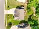 Aerial view of a residential property showing the roof, driveway, backyard with deck, and surrounding greenery at 169 Halifax Dr, Fort Mill, SC 29707