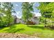 Spacious backyard with a creek and a patio below a wooden deck at 169 Halifax Dr, Fort Mill, SC 29707