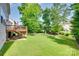 Well-maintained backyard featuring a patio, trees, and lush green grass at 169 Halifax Dr, Fort Mill, SC 29707