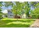 Spacious, fenced backyard featuring a well-maintained lawn and mature trees at 169 Halifax Dr, Fort Mill, SC 29707