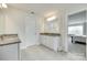 Bright bathroom with granite countertops, white cabinets, and neutral tile flooring and decor at 169 Halifax Dr, Fort Mill, SC 29707