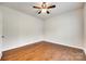 Empty bedroom featuring hardwood floors, ceiling fan, and neutral paint at 169 Halifax Dr, Fort Mill, SC 29707