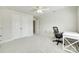 Bright bedroom with a ceiling fan, double closets, and a desk area at 169 Halifax Dr, Fort Mill, SC 29707