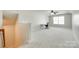 Spacious carpeted bonus room with natural light and a desk area at 169 Halifax Dr, Fort Mill, SC 29707