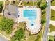 Aerial view of the community pool and clubhouse, showcasing amenities like seating, splash fountain, and pool lanes at 169 Halifax Dr, Fort Mill, SC 29707