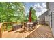 Wooden deck with outdoor seating and a grill, perfect for entertaining guests at 169 Halifax Dr, Fort Mill, SC 29707