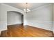 Dining room featuring hardwood floors, chandelier, and arched doorway at 169 Halifax Dr, Fort Mill, SC 29707