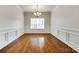 Formal dining room with hardwood floors, chandelier, and wainscoting at 169 Halifax Dr, Fort Mill, SC 29707