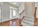 Bright foyer with hardwood floors, staircase, and glass-paneled front door at 169 Halifax Dr, Fort Mill, SC 29707