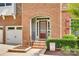 Close-up of the front door with a brick archway and decorative shrubbery at 169 Halifax Dr, Fort Mill, SC 29707