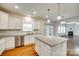 Open concept kitchen with granite countertops, stainless steel appliances, and access to the living area at 169 Halifax Dr, Fort Mill, SC 29707