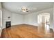 Open living room with hardwood floors, fireplace, and connecting archway at 169 Halifax Dr, Fort Mill, SC 29707