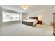 Spacious main bedroom features a large window, neutral carpet, and ceiling fan at 169 Halifax Dr, Fort Mill, SC 29707