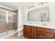 Bathroom with tile floor, a glass shower and dual sink vanity at 1691 Ashley Lynn Ct, Stanfield, NC 28163