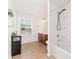 Well-lit bathroom featuring a shower-tub, tile floors, and ample counter space at 1691 Ashley Lynn Ct, Stanfield, NC 28163