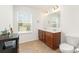 Bright bathroom featuring a dual vanity, tile floors, and a window at 1691 Ashley Lynn Ct, Stanfield, NC 28163
