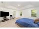 Spacious bedroom featuring tray ceiling, carpet, and a versatile layout for a relaxing retreat at 1691 Ashley Lynn Ct, Stanfield, NC 28163