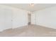 Cozy bedroom with carpet, closet, and open doorway to the rest of the home at 1691 Ashley Lynn Ct, Stanfield, NC 28163