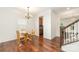 Inviting dining area with hardwood floors, chandelier, and ample natural light at 1691 Ashley Lynn Ct, Stanfield, NC 28163