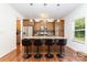 Well-equipped kitchen island featuring granite countertops, stainless steel appliances, and seating at 1691 Ashley Lynn Ct, Stanfield, NC 28163