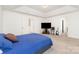Spacious bedroom with tray ceiling, plush carpet, and ample natural light at 1691 Ashley Lynn Ct, Stanfield, NC 28163
