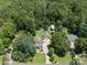 Aerial view of home on a verdant lawn with mature shade trees at 179 Delwood Ct, Mount Gilead, NC 27371