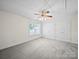 Spacious empty bedroom with neutral carpet and ceiling fan; ready to personalize at 179 Delwood Ct, Mount Gilead, NC 27371