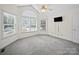 Empty bedroom with large windows, ceiling fan, and neutral tones at 179 Delwood Ct, Mount Gilead, NC 27371