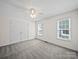 Bright bedroom features neutral carpet, ceiling fan, and double windows for ample natural light at 179 Delwood Ct, Mount Gilead, NC 27371