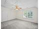 Bright, empty bedroom with large window and neutral carpet at 179 Delwood Ct, Mount Gilead, NC 27371