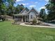 Charming two-story home with a welcoming front porch and meticulously maintained landscaping at 179 Delwood Ct, Mount Gilead, NC 27371