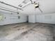 Spacious two car garage with abundant lighting and storage shelves at 179 Delwood Ct, Mount Gilead, NC 27371