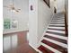 View of staircase featuring hardwood steps and a spacious room in the background at 179 Delwood Ct, Mount Gilead, NC 27371