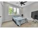 Bedroom with natural light, neutral walls and a TV at 1933 W Trade St, Charlotte, NC 28216