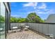 This outdoor space features a small bistro set overlooking the trees, with an open-air design at 1933 W Trade St, Charlotte, NC 28216
