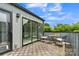 This patio features a tiled floor, metal railing, and sliding glass door for a seamless indoor-outdoor experience at 1933 W Trade St, Charlotte, NC 28216