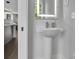 This powder room features a pedestal sink with modern faucet and a bright, clean aesthetic at 1933 W Trade St, Charlotte, NC 28216