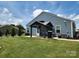 Beautiful backyard with a well-maintained lawn, patio, a gazebo, and a grill, perfect for outdoor living at 195 Willow Valley Dr, Mooresville, NC 28115