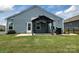 Spacious backyard featuring a well-kept lawn, gazebo, patio, and privacy fence, creating a serene outdoor oasis at 195 Willow Valley Dr, Mooresville, NC 28115