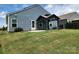 Well-manicured backyard with a gazebo, patio, and lush lawn, providing an inviting space for entertaining at 195 Willow Valley Dr, Mooresville, NC 28115