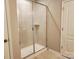 Bathroom featuring a tiled shower with glass door and neutral-toned walls and floors at 195 Willow Valley Dr, Mooresville, NC 28115