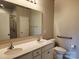 Bathroom features dual sink vanity and a shower with glass door at 195 Willow Valley Dr, Mooresville, NC 28115