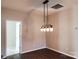 Dining Room with modern light fixture, hard wood floors, neutral paint and open doorway at 195 Willow Valley Dr, Mooresville, NC 28115