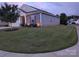 Exterior shot of a house on a lawn with trimmed bushes at twilight at 195 Willow Valley Dr, Mooresville, NC 28115