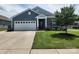 Attractive home featuring a lush lawn and tidy landscaping that enhances its curb appeal at 195 Willow Valley Dr, Mooresville, NC 28115