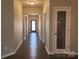 Hallway with a pantry and dark wood floors and neutral colored walls at 195 Willow Valley Dr, Mooresville, NC 28115