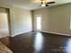 Open living room featuring hardwood floors and a door leading to outdoor space at 195 Willow Valley Dr, Mooresville, NC 28115